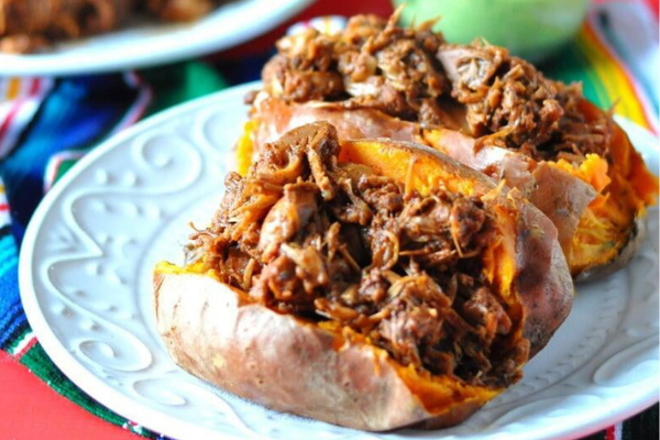 BBQ JACKFRUIT STUFFED SWEET POTATOES WITH AVOCADO CREMA